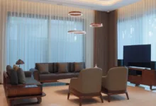 Ruang tamu bergaya dengan furnitur kontemporer dan pencahayaan elegan.